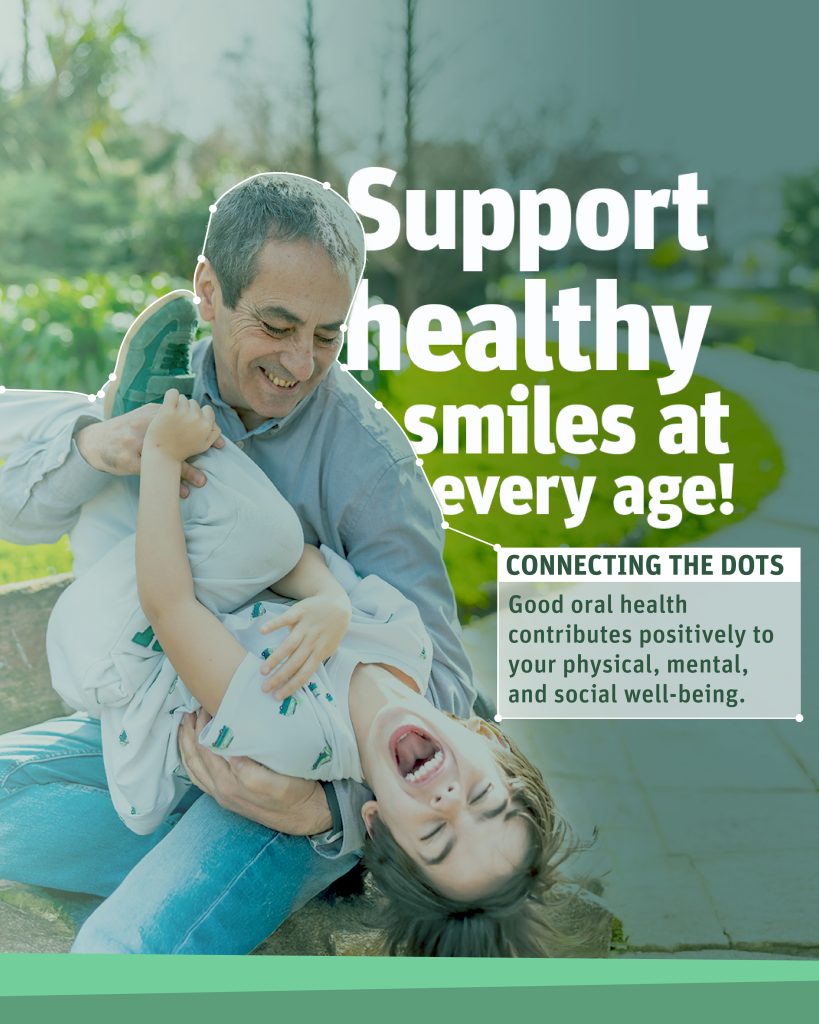 A smiling grandfather and his smiling grandson in the park. Connecting the dots: Good oral health contributes positively to your physical, mental, and social well-being.